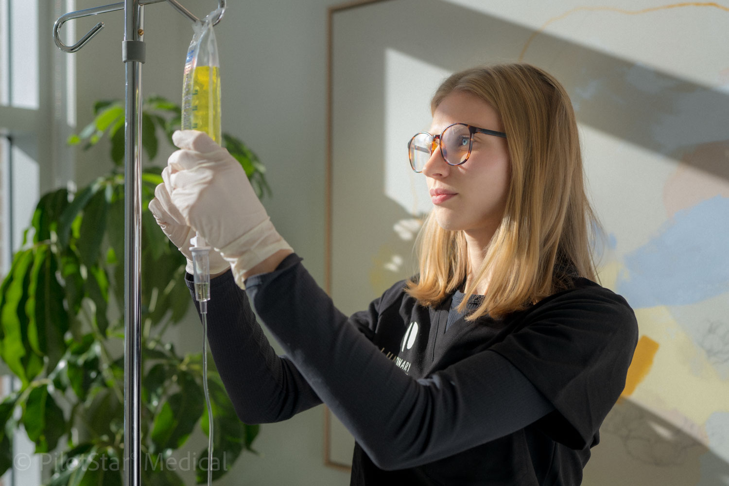 Clinic team member preparing an IV